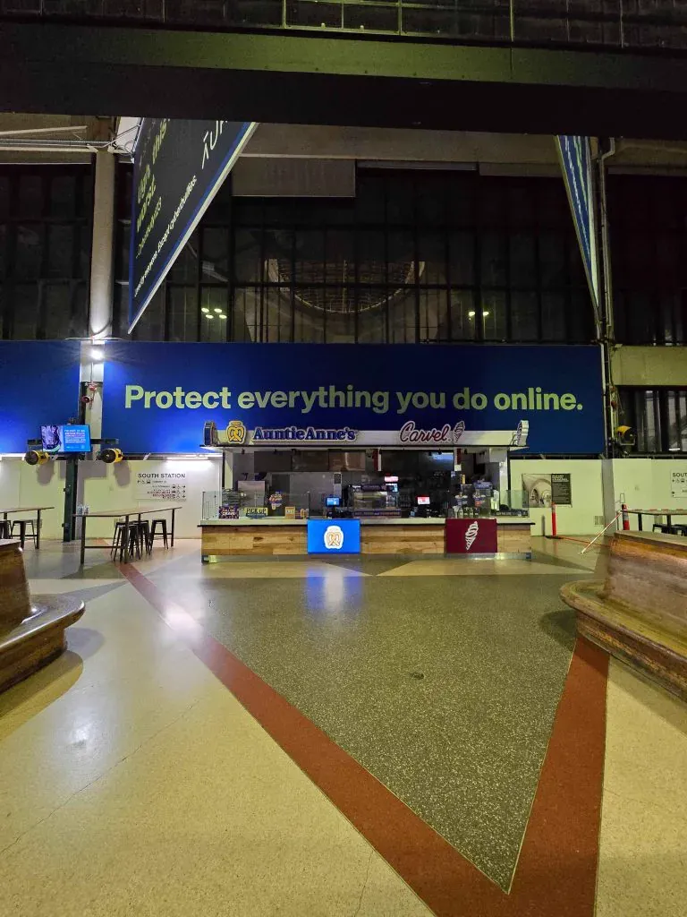 Large-format overhead banner in South Station concourse