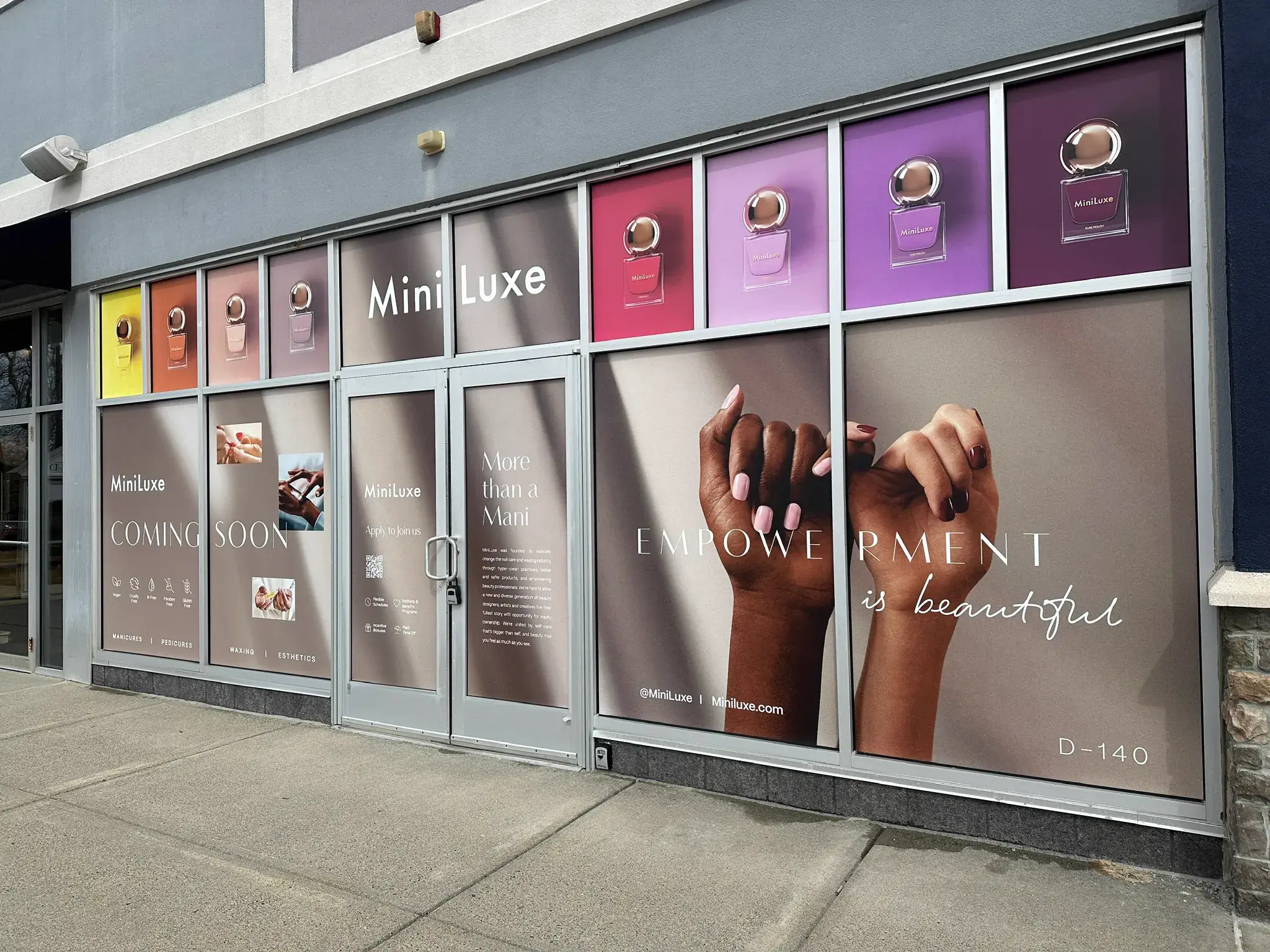 MiniLuxe storefront wrap showing polish bottle transom panels