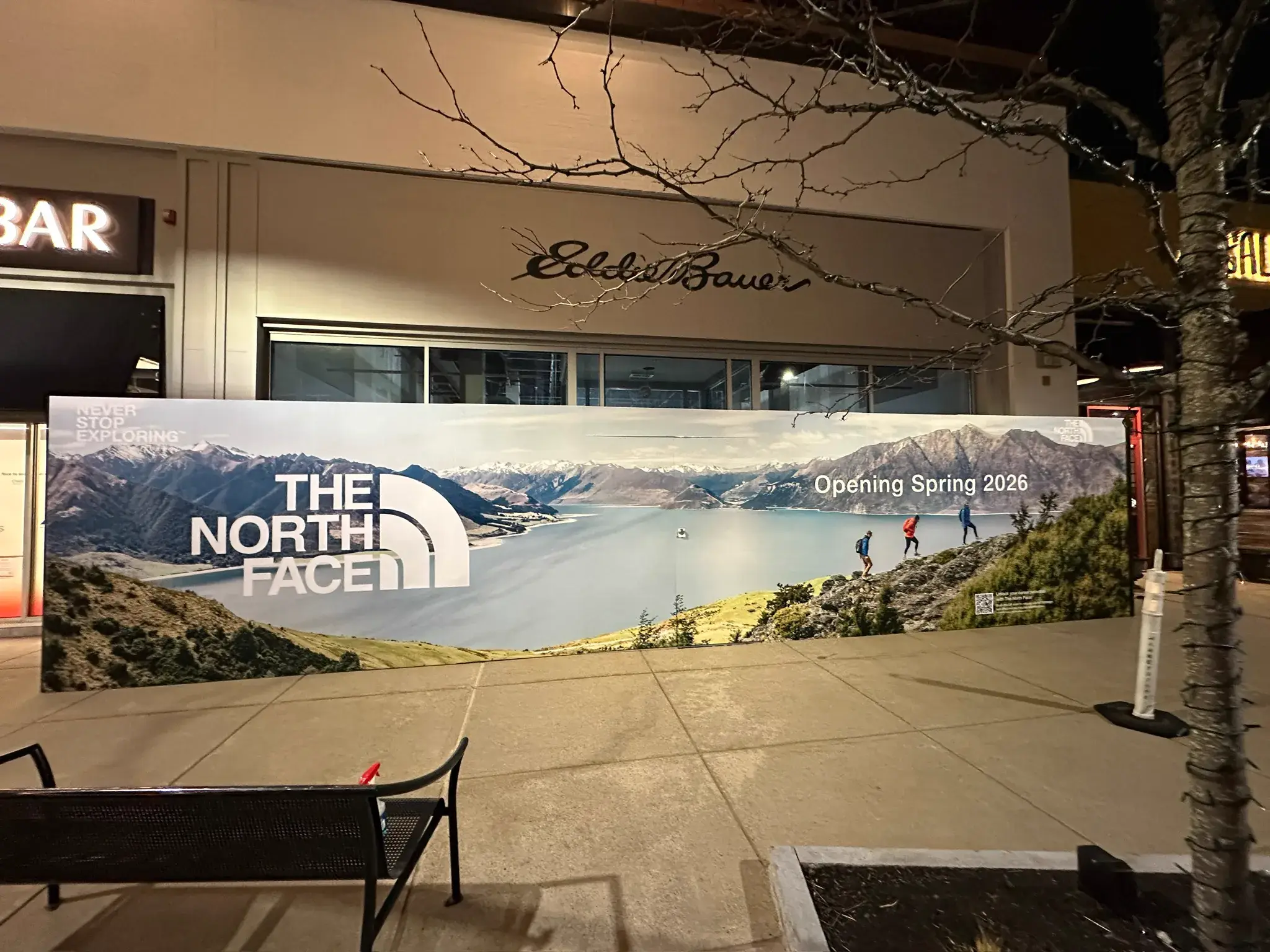 Wide night view of The North Face hoarding wrap