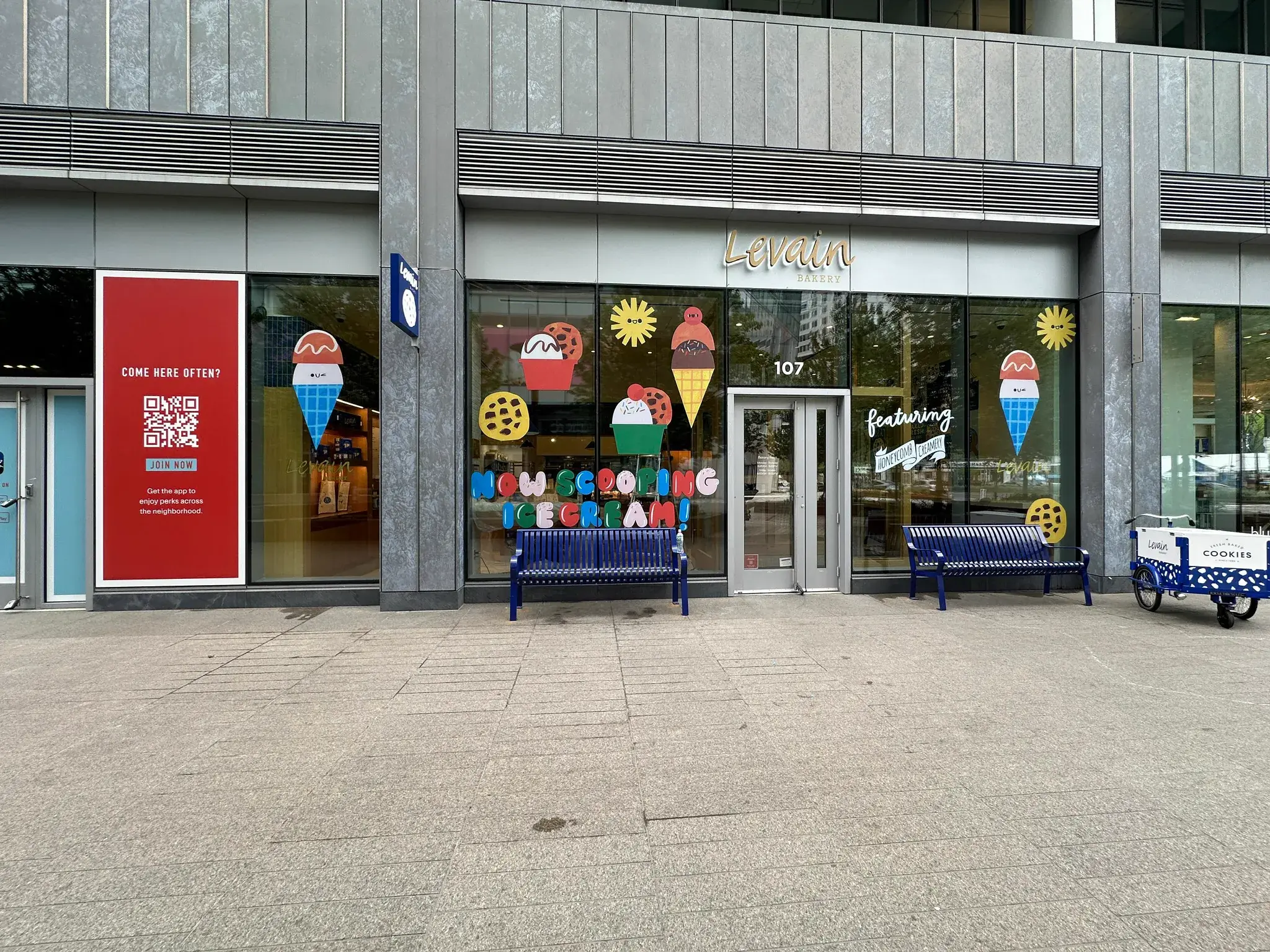 Levain Bakery storefront with ice cream cone and cookie window decals