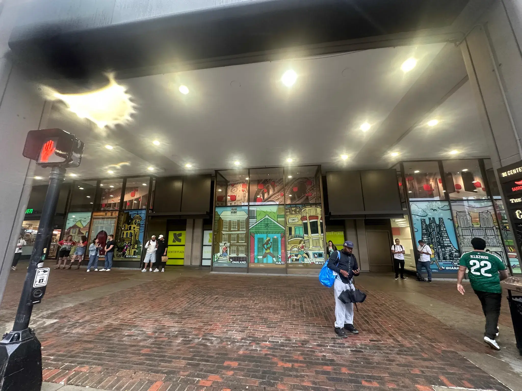 Center Plaza storefront glass wrapped with illustrated country graphics