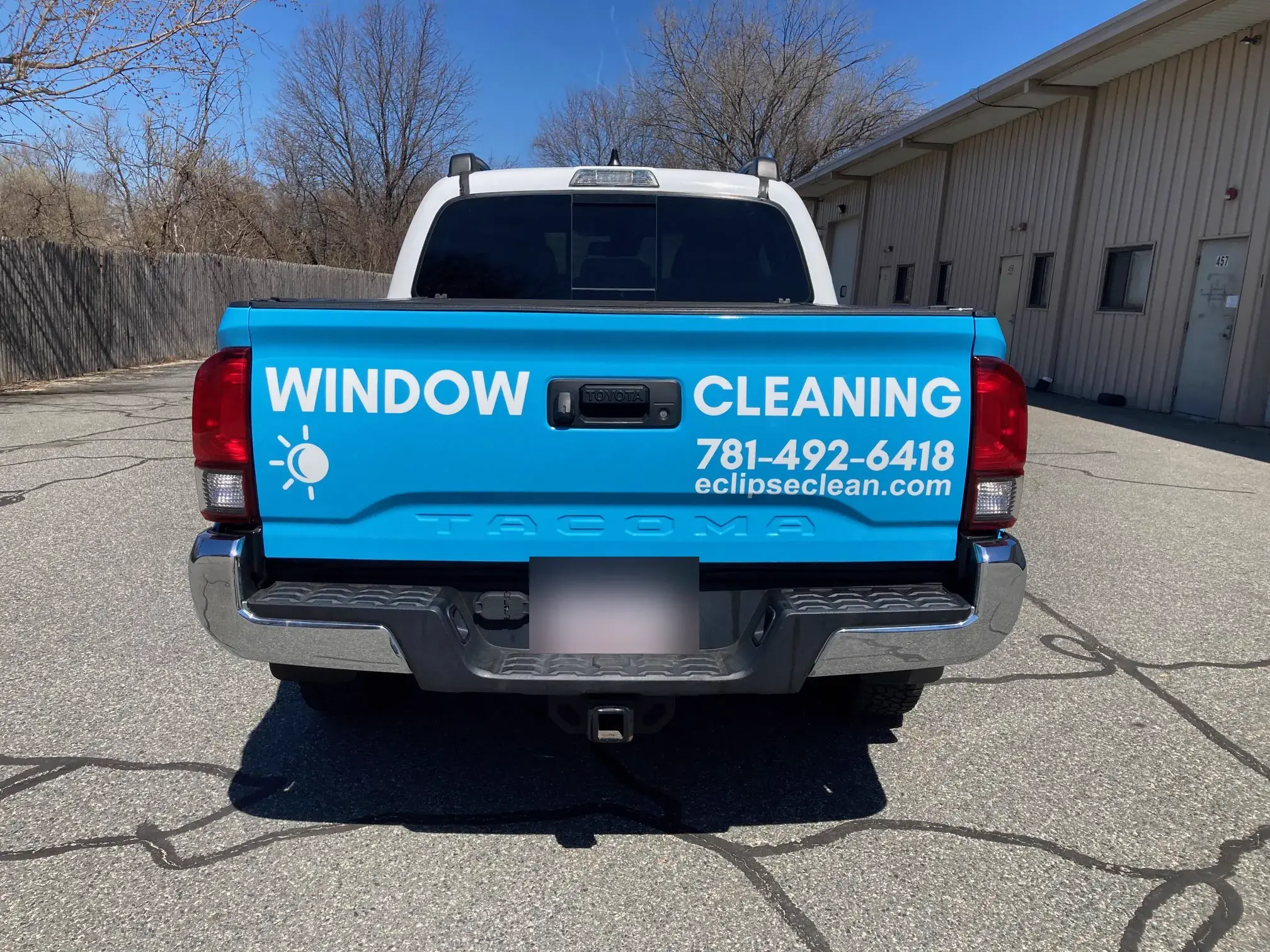 Tailgate of the wrapped Eclipse Window Cleaning pickup