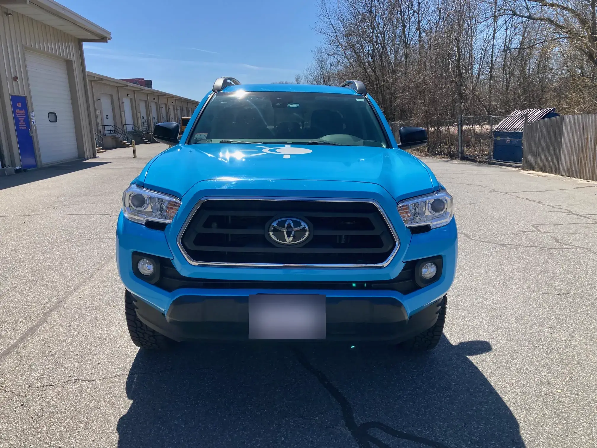 Front view of the wrapped Eclipse Window Cleaning pickup showing the hood graphic