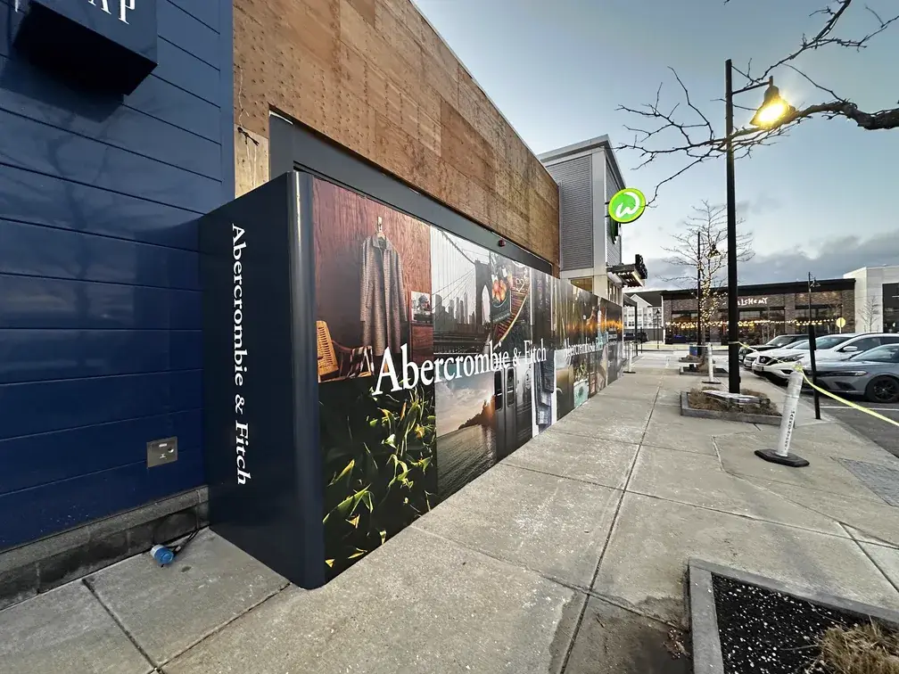 Abercrombie and Fitch exterior construction hoarding at dusk