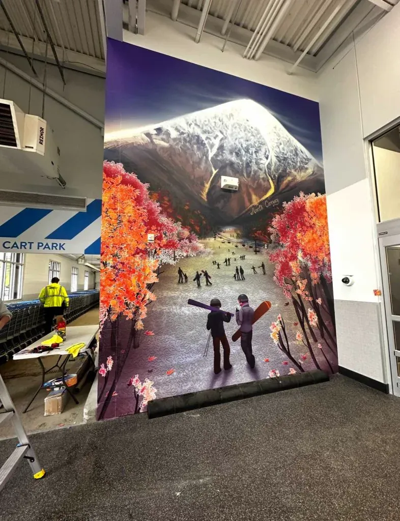 Full-height retail wall mural installed by Theory Media