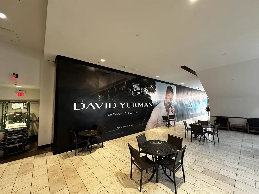 David Yurman Chevron Collection hoarding beside a seating area