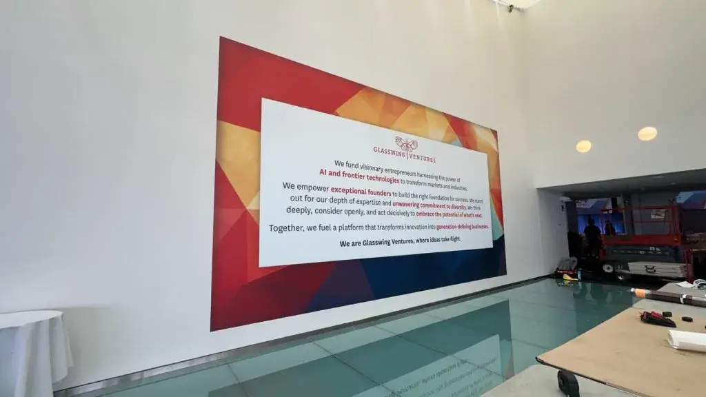 Glasswing Ventures manifesto wall graphic in an office lobby