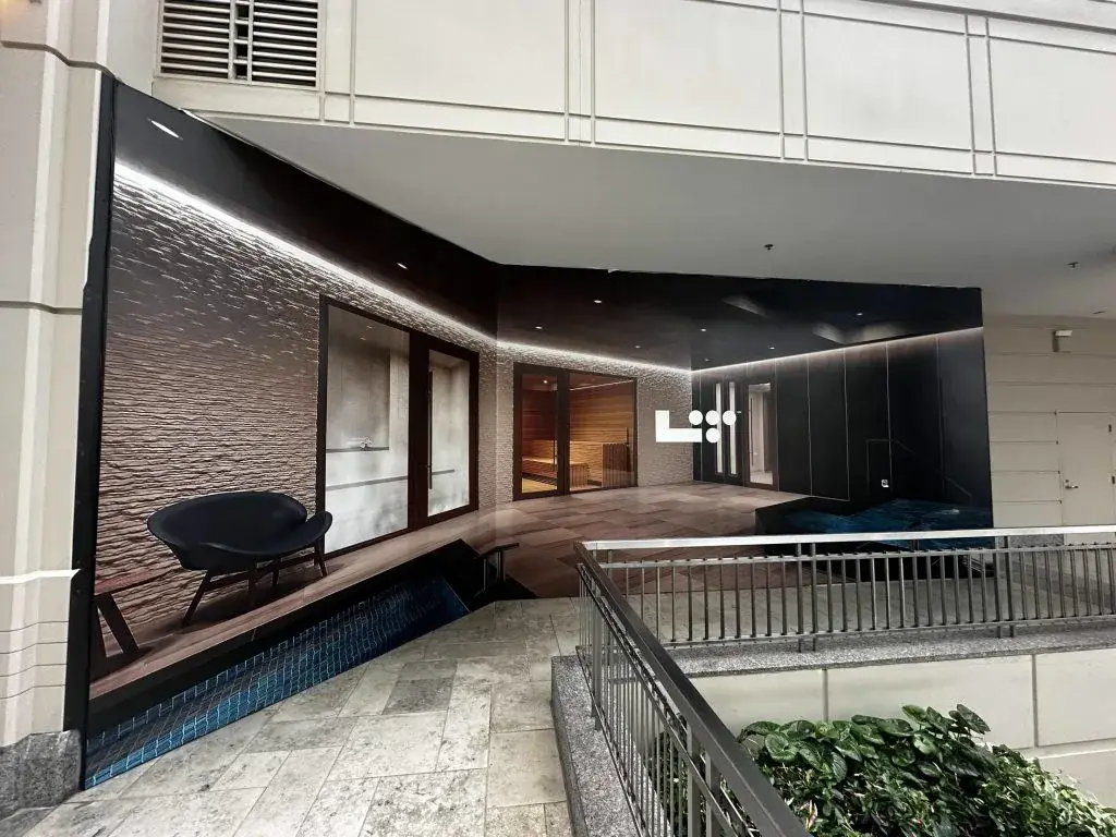 Large-format architectural hoarding screening a construction area