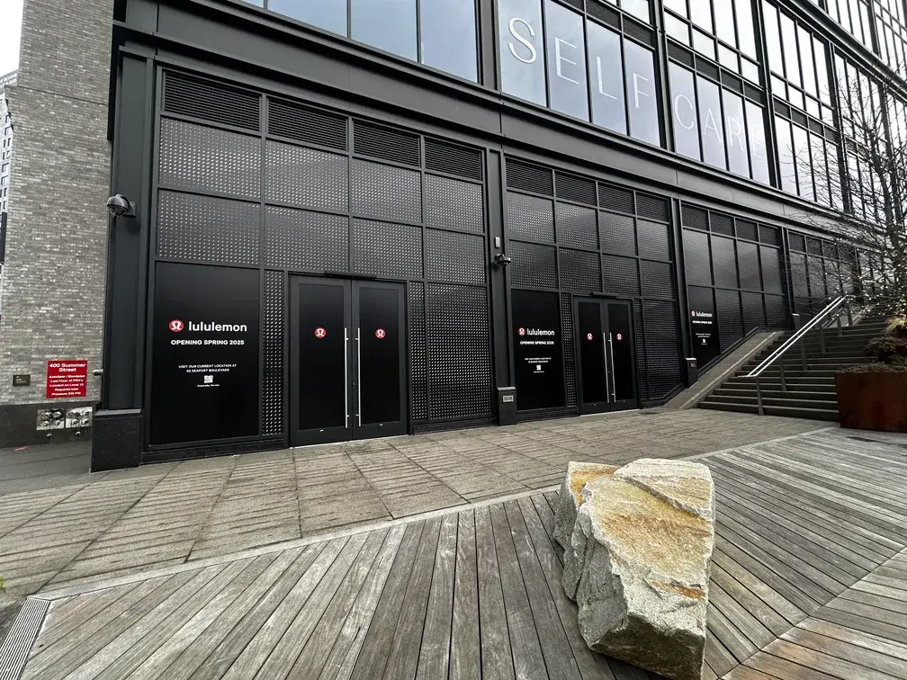 lululemon opening spring 2025 window decals on a Seaport storefront