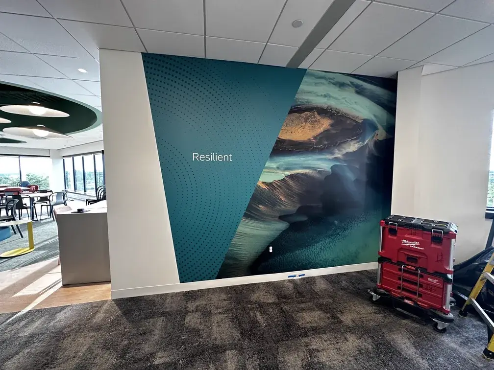 Office wall mural reading Resilient with an aerial landscape photograph